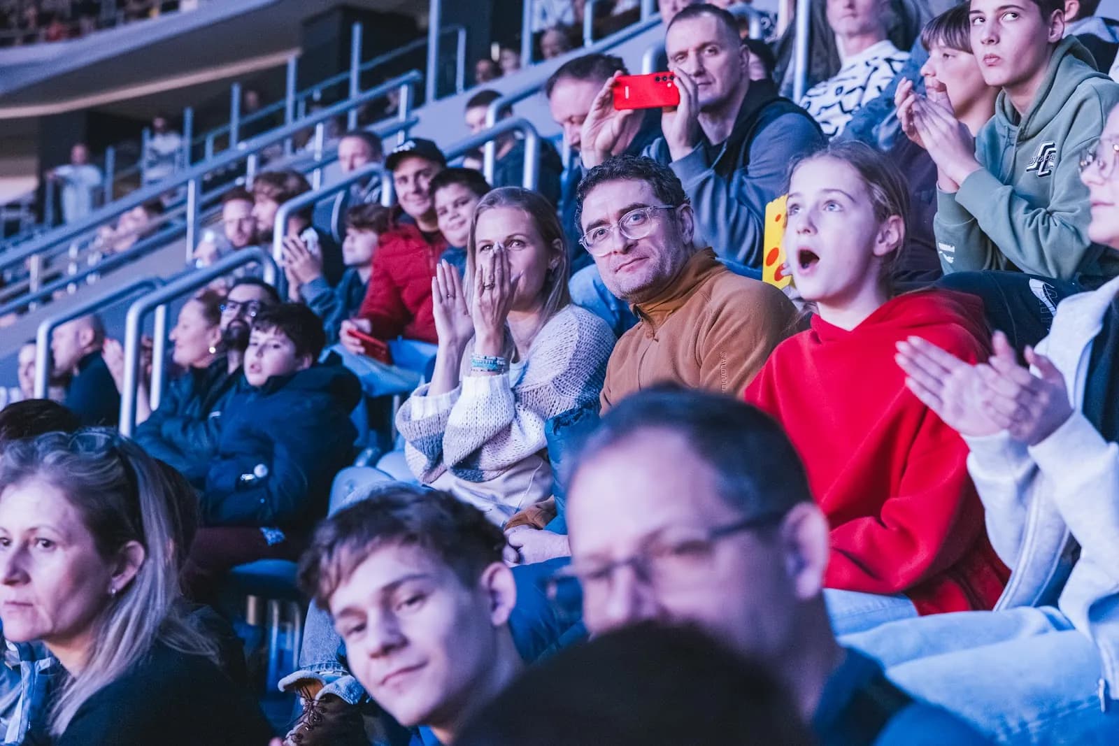 Fans and kids in the stands in Zagreb, staring up at a rider in mid-air