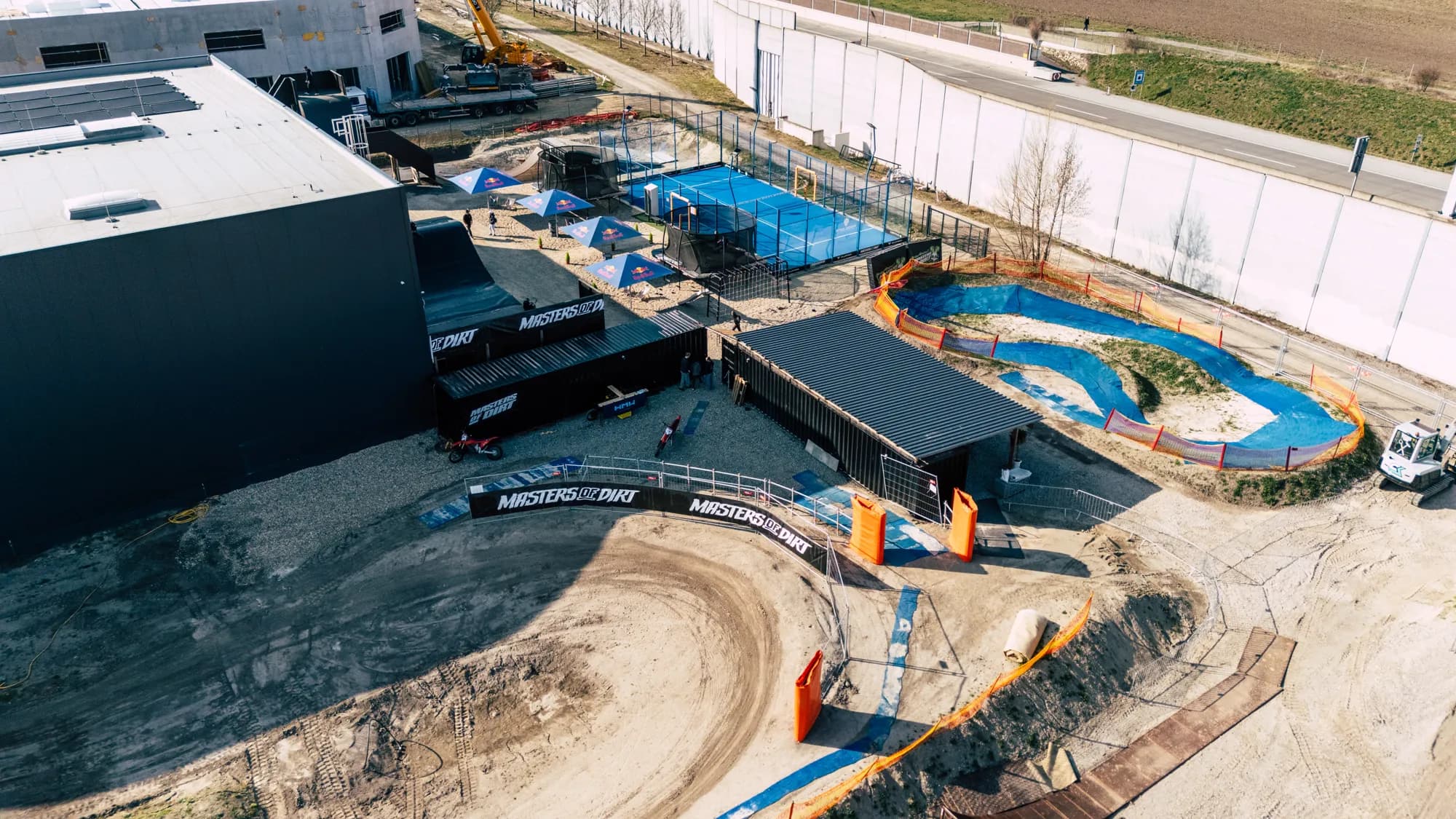 Aerial view of M.O.D World: pump track, trampolines and padel court
