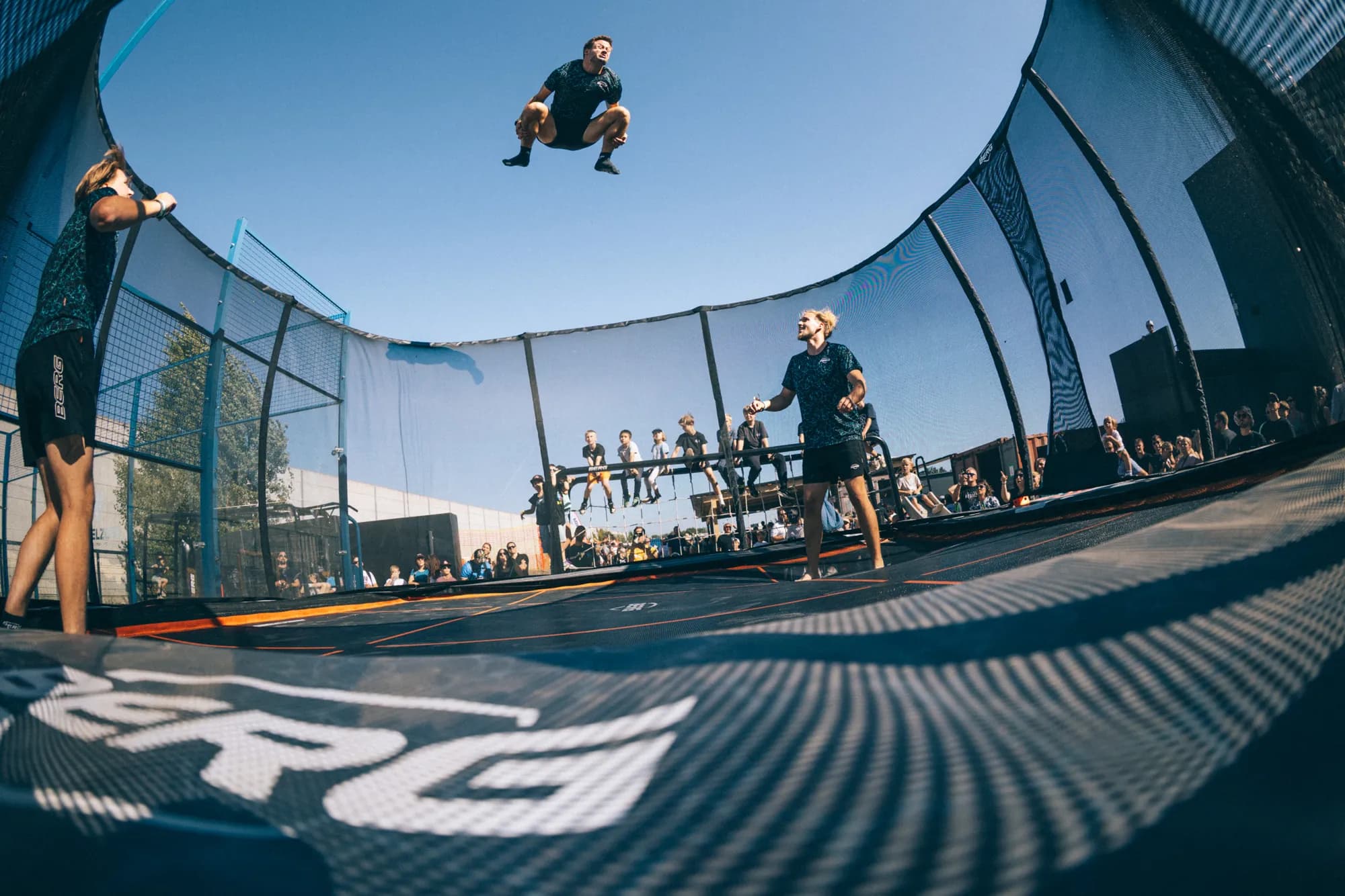 Jumper mid-air above the trampoline area