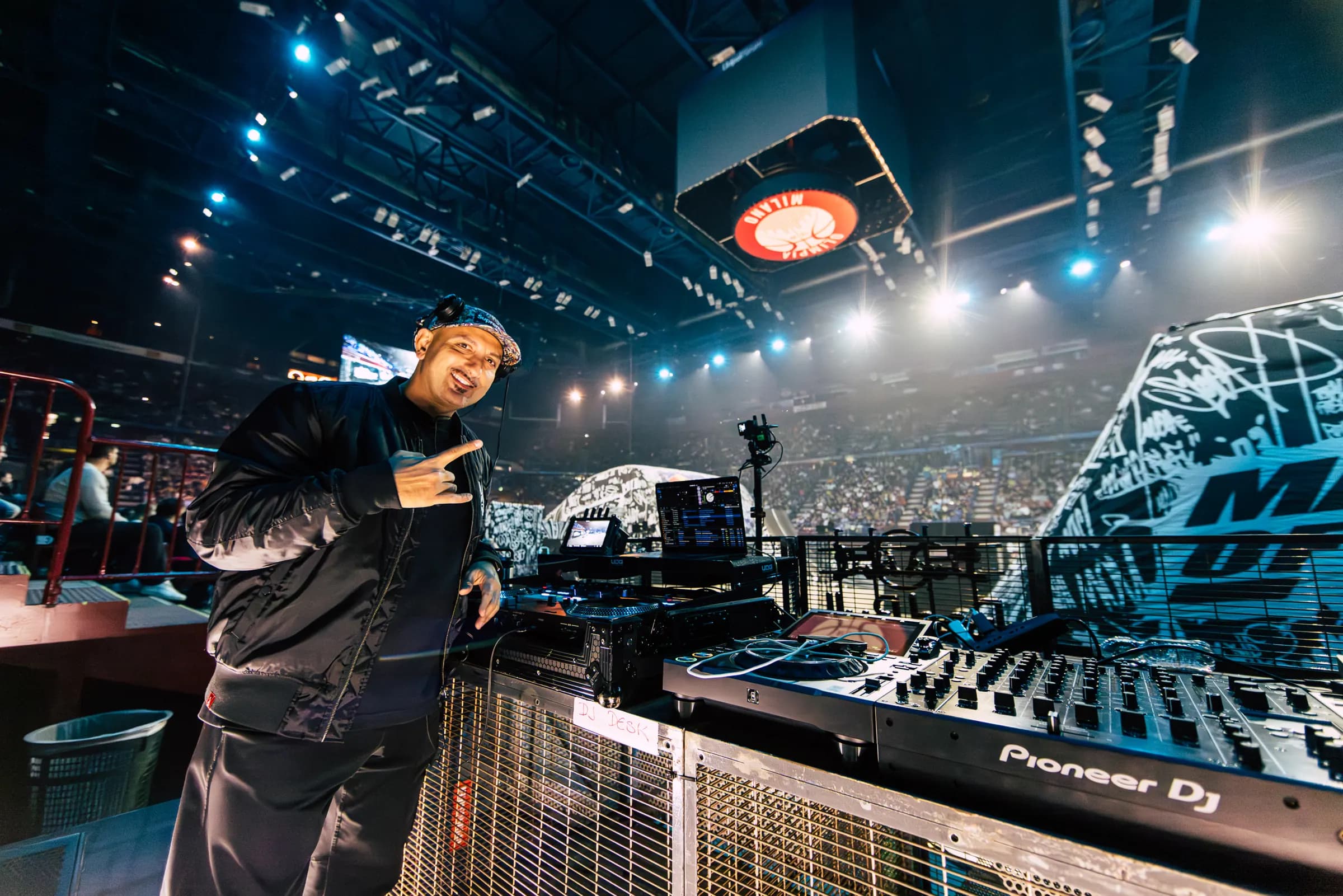 DJ Mosaken on the decks in front of a packed arena