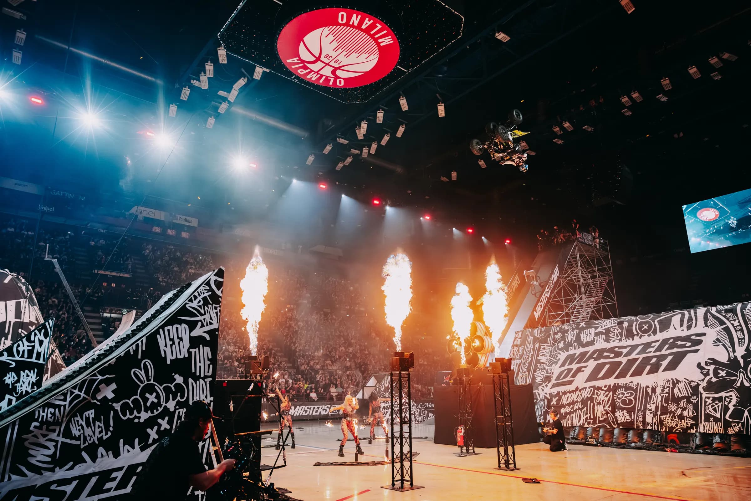 Quad jump between pyro fountains in the Milan arena