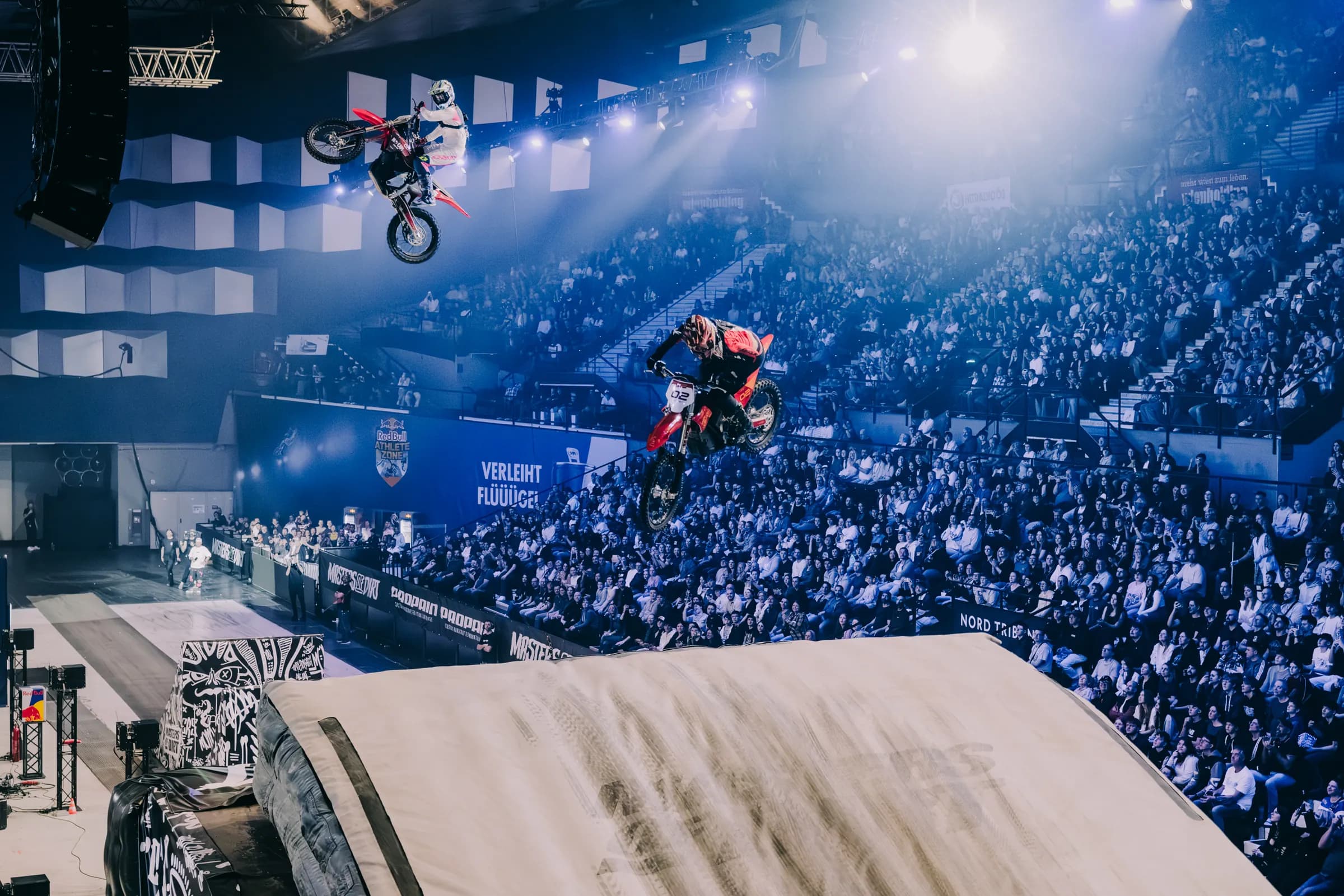 FMX rider Wyatt Fontenot flying over packed stands at Wiener Stadthalle in Vienna