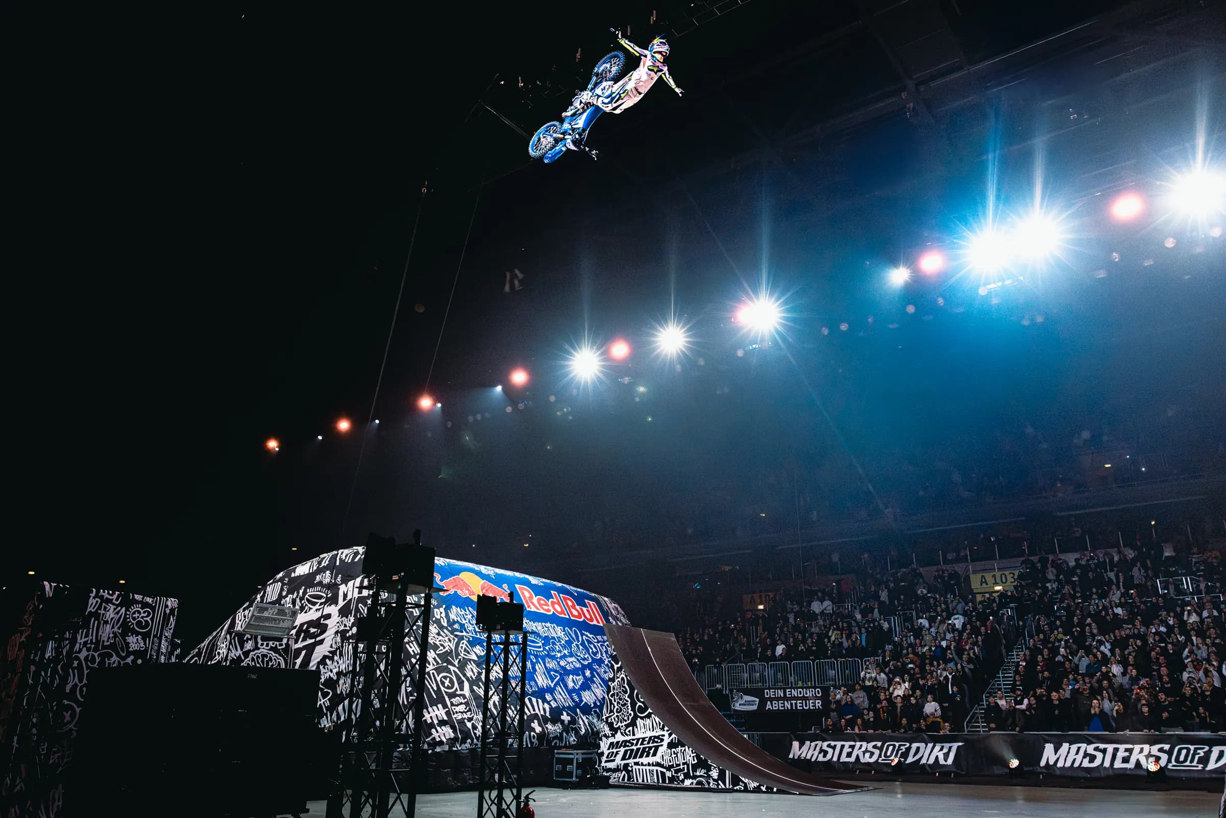 FMX jump under the arena spotlights